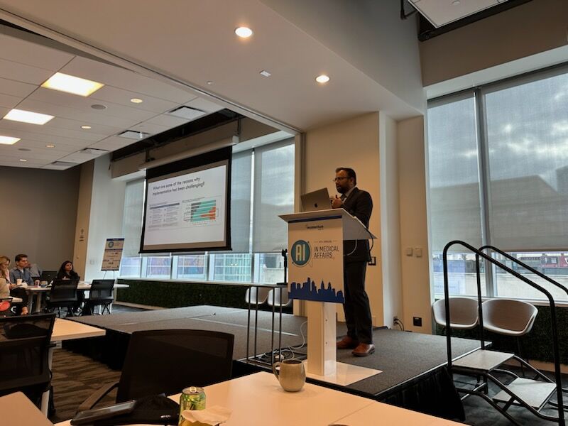 Vivek Mukhatyar delivering opening remarks at the 2025 AI in Medical Affairs meeting.