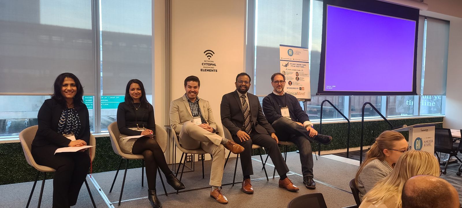 Vivek Mukhatyar seated with panelists at the 2025 AI in Medical Affairs meeting.