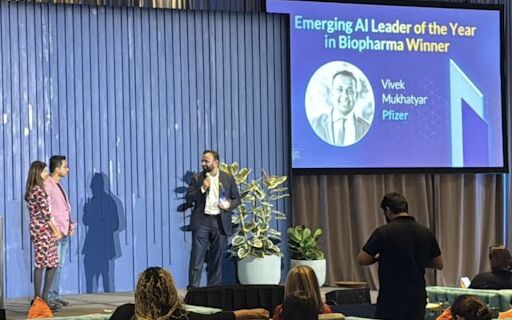 Vivek Mukhatyar on stage receiving the Emerging AI Leader of the Year in Biopharma recognition at Articulate 2025.